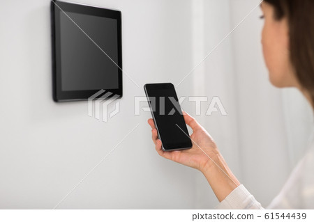 woman using tablet computer and smartphone woman using tablet computer and smartphone 61544439