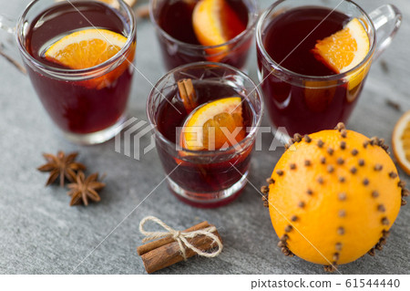 glasses of mulled wine with orange and cinnamon glasses of mulled wine with orange and cinnamon 61544440