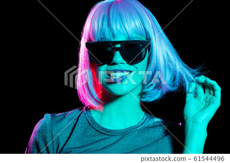 happy woman in pink wig and black sunglasses happy woman in pink wig and black sunglasses 61544496