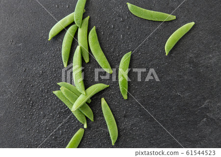 peas on wet slate stone background peas on wet slate stone background 61544523