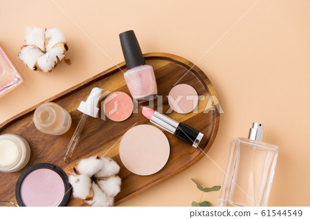 makeup, perfume and cosmetics on wooden tray 61544549