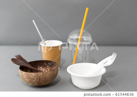 close up of eco friendly and plastic tableware 61544636