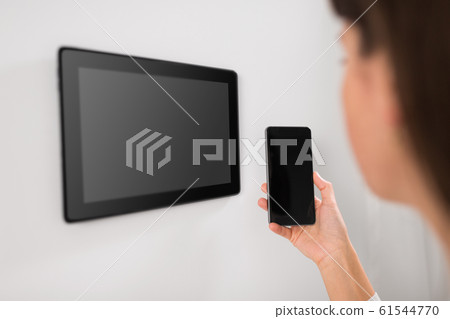 woman using tablet computer and smartphone woman using tablet computer and smartphone 61544770