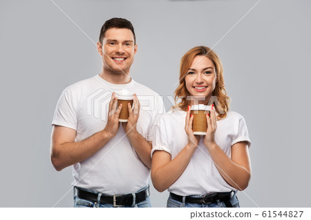 portrait of happy couple with takeaway coffee cups 61544827