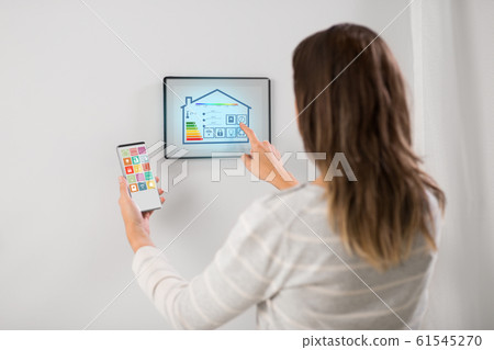 woman using tablet computer and smartphone woman using tablet computer and smartphone 61545270