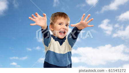 little boy making scary faces over sky background little boy making scary faces over sky background 61545272