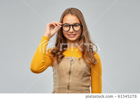 smiling teenage student girl in glasses smiling teenage student girl in glasses 61545278