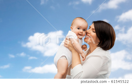 happy middle-aged mother with little baby daughter happy middle-aged mother with little baby daughter 61545522