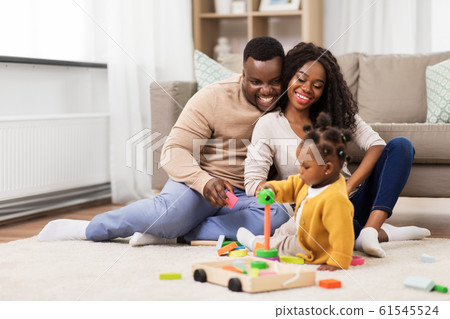 african family playing with baby daughter at home african family playing with baby daughter at home 61545524