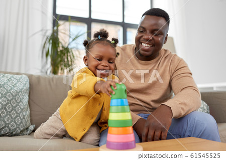 african family playing with baby daughter at home african family playing with baby daughter at home 61545525