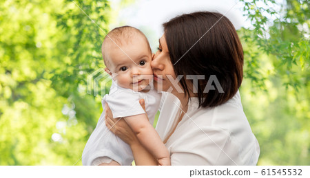 happy mother kissing little baby daughter happy mother kissing little baby daughter 61545532