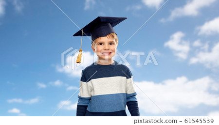 little boy in bachelor hat or mortarboard over sky little boy in bachelor hat or mortarboard over sky 61545539