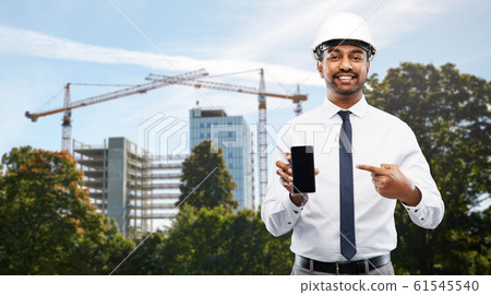 architect showing smartphone at construction site architect showing smartphone at construction site 61545540