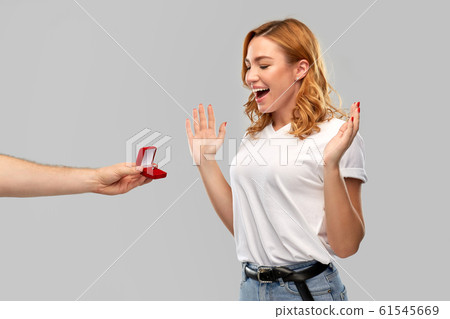 man giving woman engagement ring on valentines day man giving woman engagement ring on valentines day 61545669