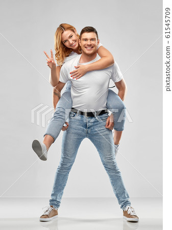 happy couple in white t-shirts having fun 61545709