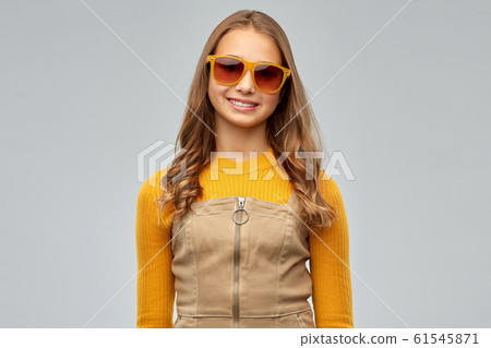 smiling young teenage girl in sunglasses smiling young teenage girl in sunglasses 61545871