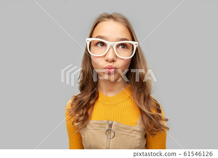 teenage student girl in glasses making faces 61546126