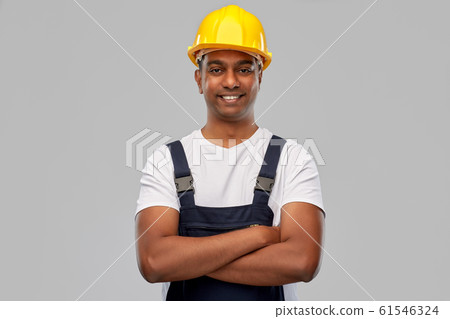 happy indian worker or builder with crossed arms 61546324