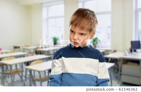 portrait of gloomy little boy at school portrait of gloomy little boy at school 61546362