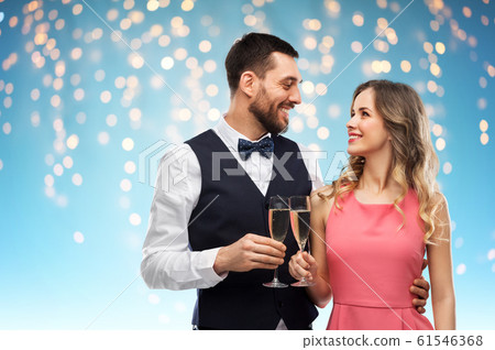 happy couple with champagne glasses toasting happy couple with champagne glasses toasting 61546368