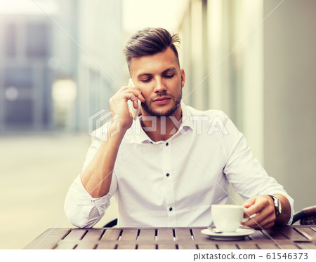 man with coffee calling on smartphone at city cafe man with coffee calling on smartphone at city cafe 61546373