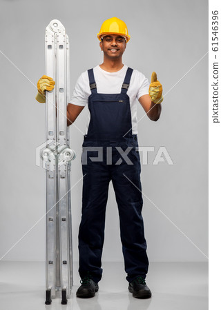 happy indian builder with ladder showing thumbs up happy indian builder with ladder showing thumbs up 61546396