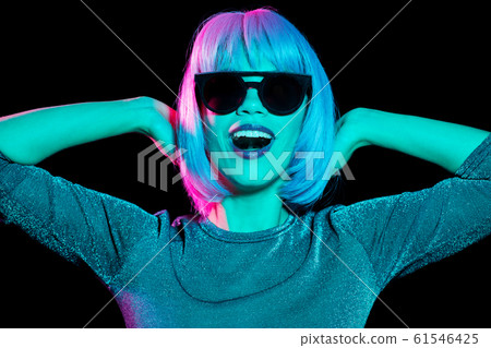 happy woman in pink wig and black sunglasses 61546425