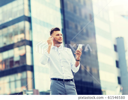 man with headphones and smartphone listening music man with headphones and smartphone listening music 61546580