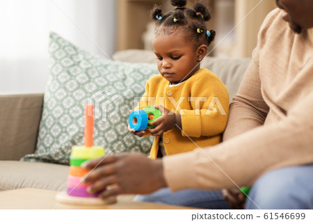 african family playing with baby daughter at home african family playing with baby daughter at home 61546699