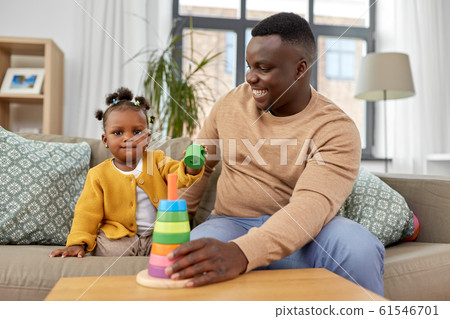 african family playing with baby daughter at home african family playing with baby daughter at home 61546701