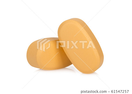 brown pills isolated on white background 61547257