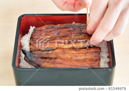 In front of the plate where the eel weight is served In front of the plate where the eel weight is served 61549979