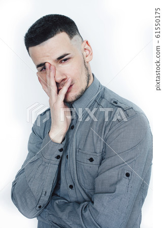 young handsome well groomed guy posing on white background gesturing smiling, lifestyle people concept 61550175