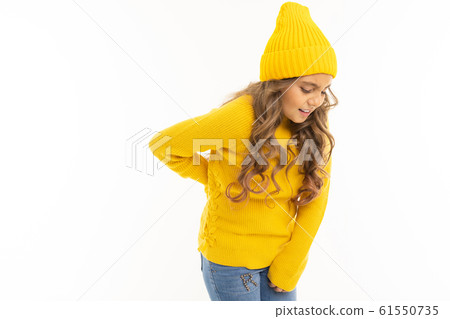 Happy caucasian girl in yellow hat and hoody have backache isolated on white background Happy caucasian girl in yellow hat and hoody have backache isolated on white background 61550735