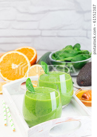 Green detox smoothie with avocado, spinach Green detox smoothie with avocado, spinach 61552387