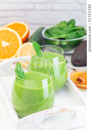 Green detox smoothie with avocado, spinach Green detox smoothie with avocado, spinach 61552388