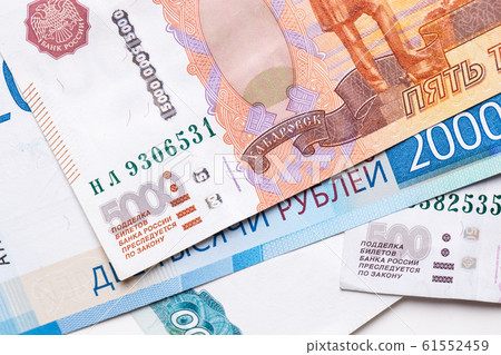 Russian ruble. Russian currency closeup in the form of texture. Russian ruble. Russian currency closeup in the form of texture. 61552459