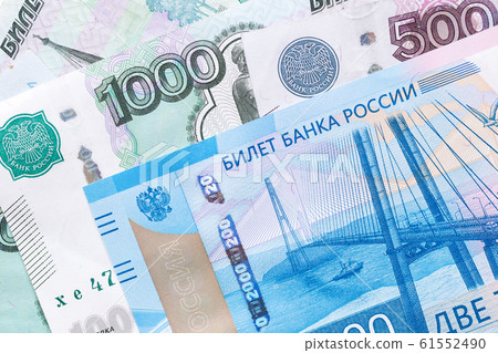 Russian ruble. Russian currency closeup in the form of texture. Russian ruble. Russian currency closeup in the form of texture. 61552490