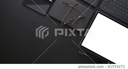 Top view of dark trendy workplace with blank 61554271
