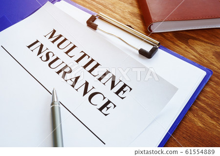 Multiline Insurance agreement and pile of papers. 61554889