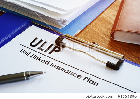 Unit Linked Insurance Plan - ULIP on the table. 61554890