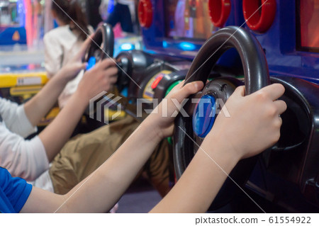 Image of a child playing in a game center Image of a child playing in a game center 61554922