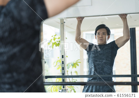 Men pulling up at the gym Men pulling up at the gym 61556171