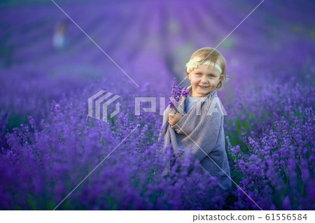 Girl child outdoor summer in natural flower field Girl child outdoor summer in natural flower field 61556584