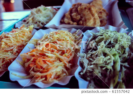 Delicious street food. Fresh salads Delicious street food. Fresh salads 61557042