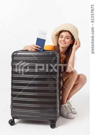 Full length of attractive young female in traveller casual with the travel bag, isolated on white background Full length of attractive young female in traveller casual with the travel bag, isolated on white background 61557675