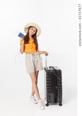 Full length of attractive young female in traveller casual with the travel bag, isolated on white background Full length of attractive young female in traveller casual with the travel bag, isolated on white background 61557677