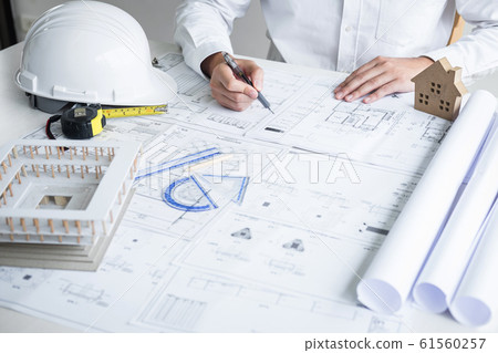 Construction engineering or architect hands 61560257