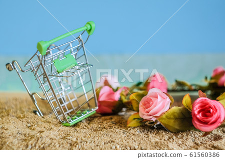 Shopping cart drop on tropical sand beach. Shopping cart drop on tropical sand beach. 61560386