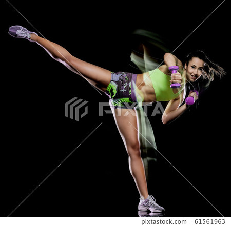 woman exercising fitness exercises isolated black background lightpainting effect woman exercising fitness exercises isolated black background lightpainting effect 61561963